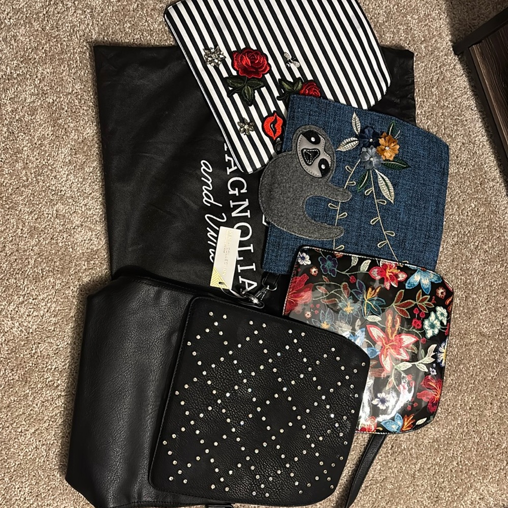 Magnolia and Vine black leather versa bag with 4 interchangeable front flaps!